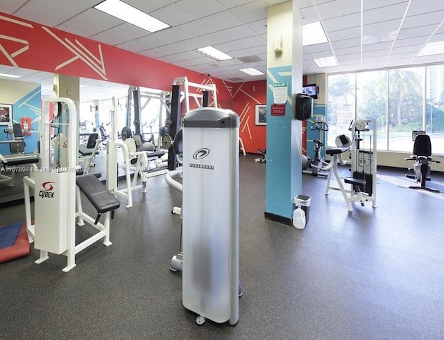 exercise room featuring a paneled ceiling