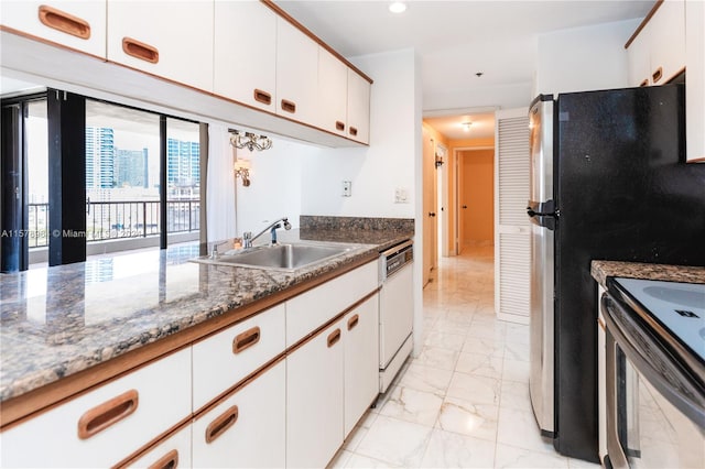 kitchen with white dishwasher, white cabinetry, sink, and light tile flooring