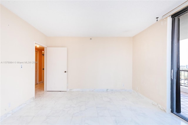 view of tiled spare room