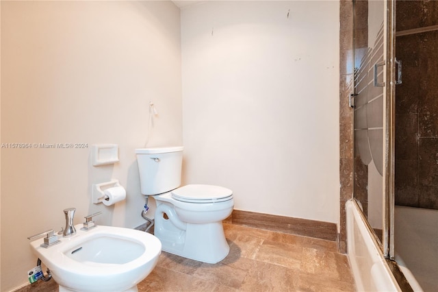 bathroom with enclosed tub / shower combo, tile floors, a bidet, and toilet