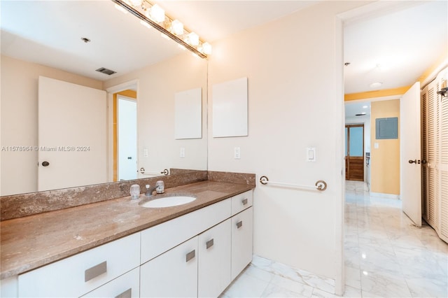 bathroom featuring oversized vanity and tile flooring