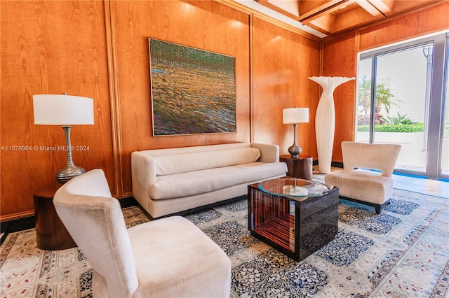 living room with wood walls, beam ceiling, and coffered ceiling