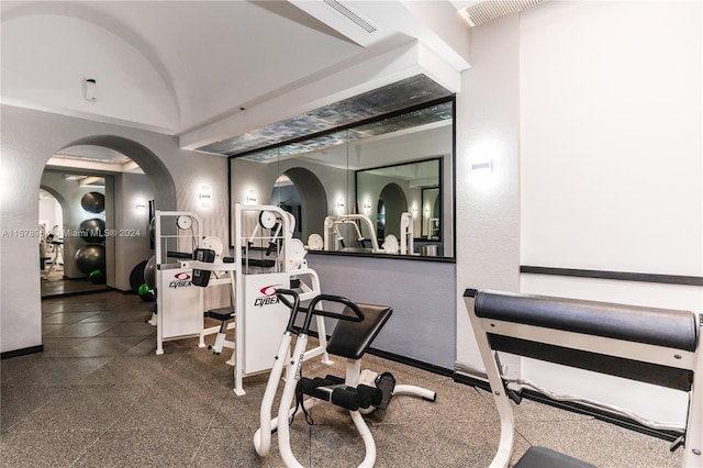 exercise room featuring tile flooring