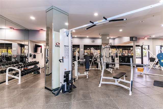 workout area with a high ceiling