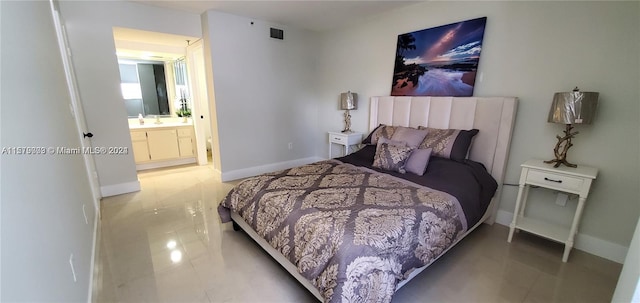 tiled bedroom with connected bathroom