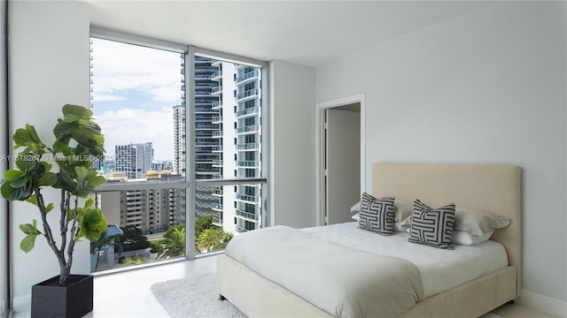 bedroom with multiple windows and expansive windows