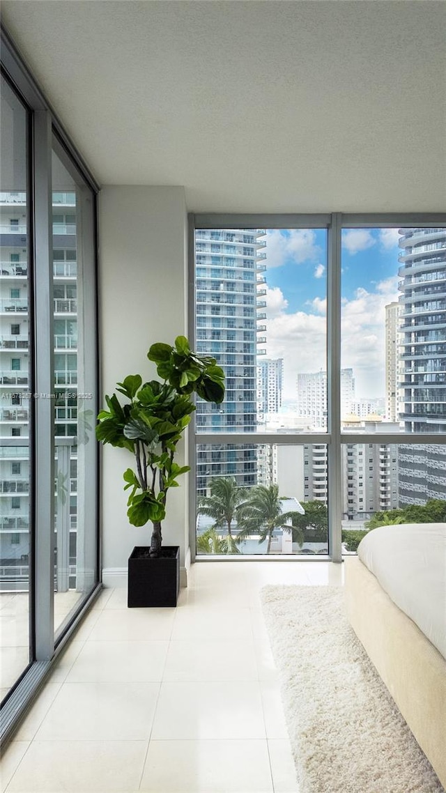 tiled bedroom with expansive windows