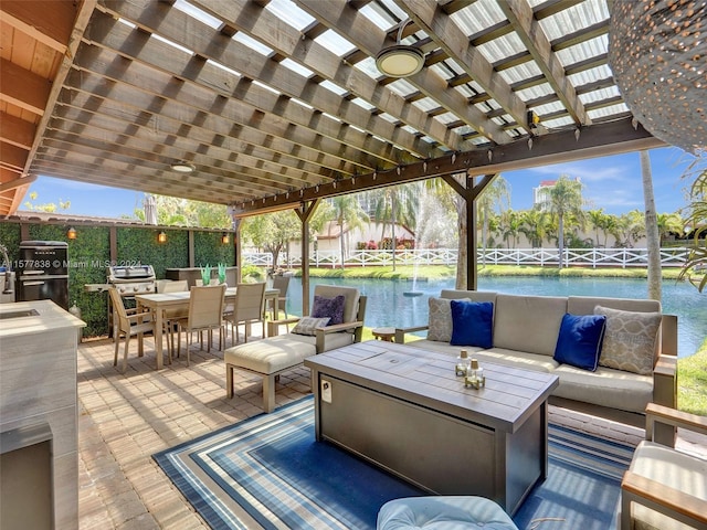 view of terrace with an outdoor hangout area, a pergola, ceiling fan, and a water view