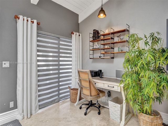 office area featuring vaulted ceiling and light tile flooring