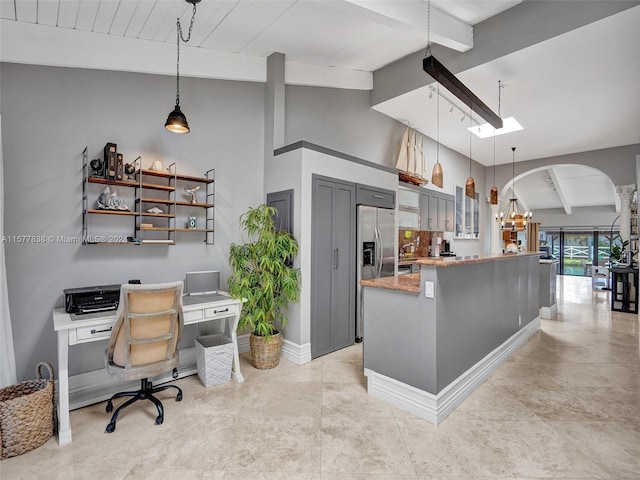 tiled office space with beam ceiling and high vaulted ceiling