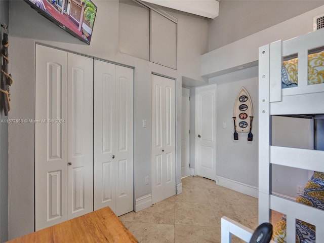 bedroom featuring light tile floors