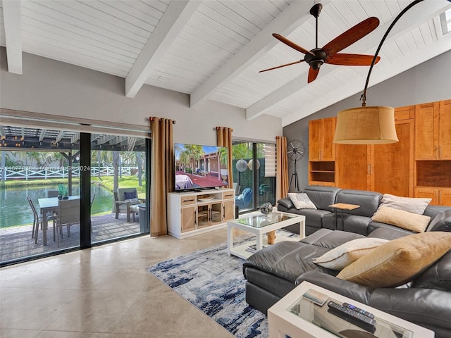 tiled living room featuring a water view, ceiling fan, a wealth of natural light, and lofted ceiling with beams