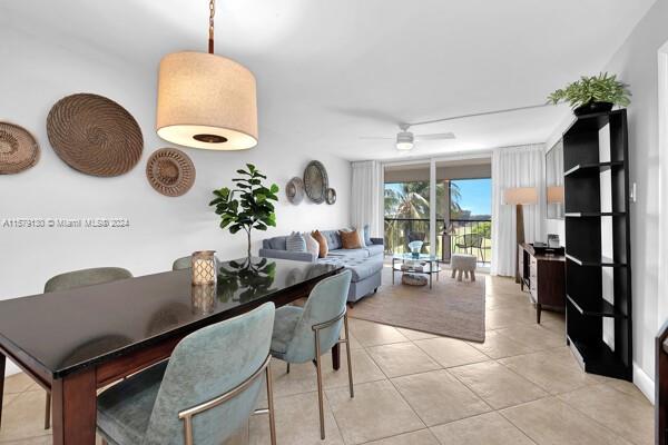 dining area featuring light tile patterned flooring and ceiling fan