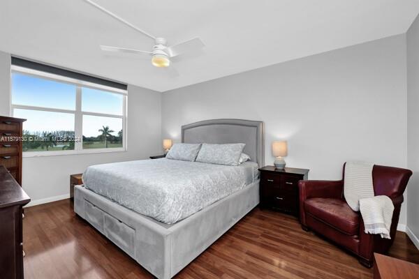 bedroom featuring dark hardwood / wood-style floors and ceiling fan