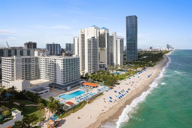 exterior space with a water view and a view of the beach