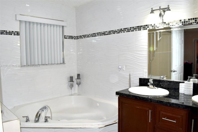 bathroom with tiled bath and large vanity