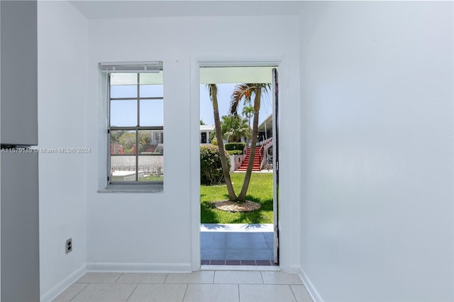 doorway with light tile flooring