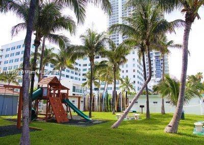 view of playground featuring a lawn