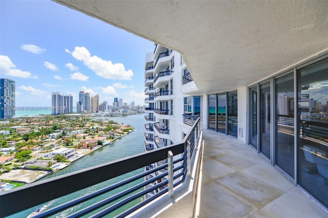 balcony featuring a water view