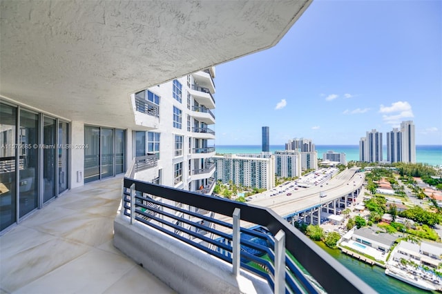 balcony featuring a water view