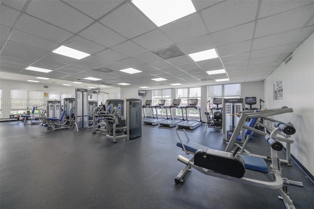 exercise room featuring a drop ceiling