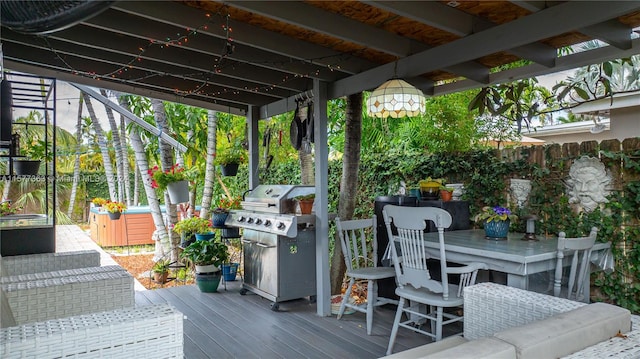 wooden terrace with a grill