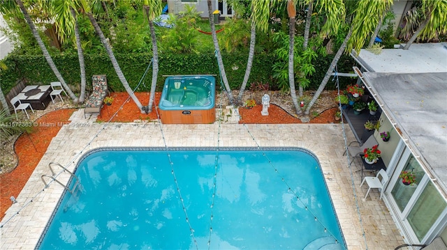 view of swimming pool with a patio area