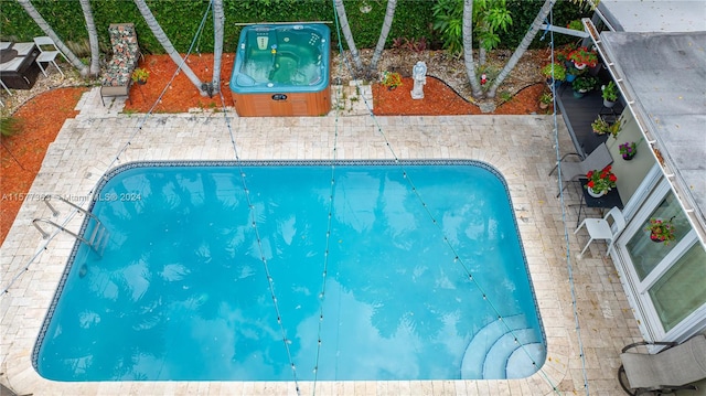 view of pool featuring a patio