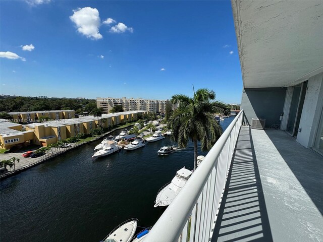 balcony featuring a water view