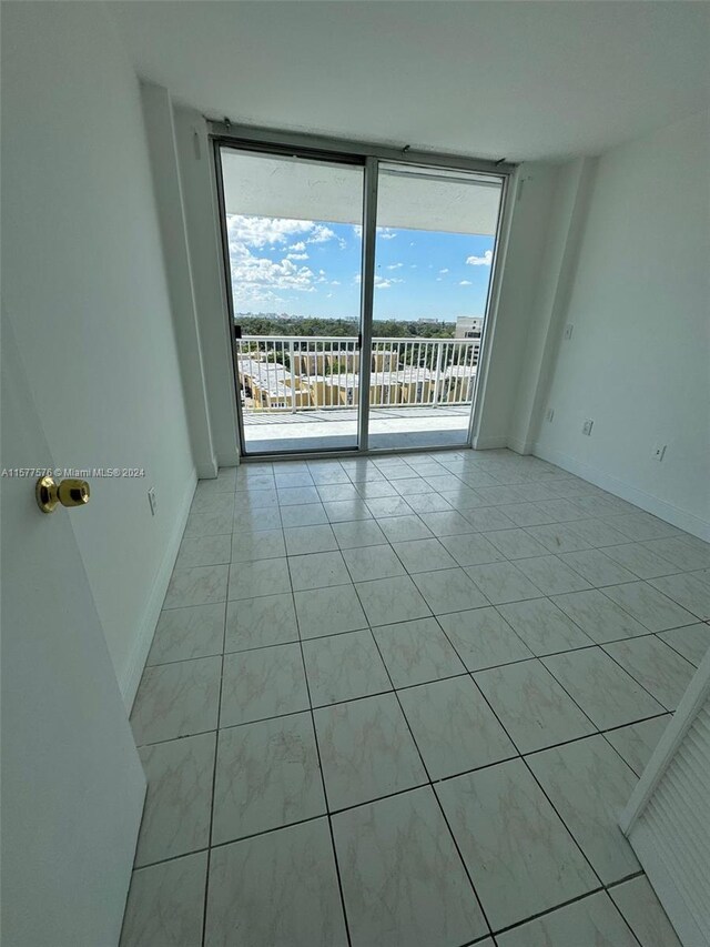 tiled empty room with expansive windows