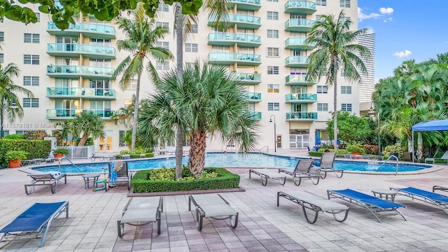 view of swimming pool with a patio area