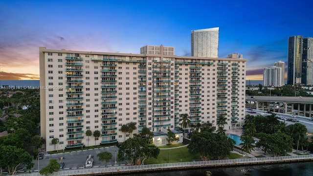 outdoor building at dusk featuring a water view