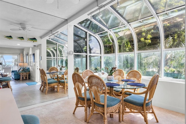 sunroom / solarium with plenty of natural light and ceiling fan