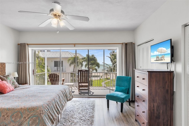 bedroom featuring ceiling fan, light wood-type flooring, and access to outside