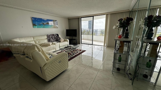 living room featuring floor to ceiling windows, a textured ceiling, and light tile floors