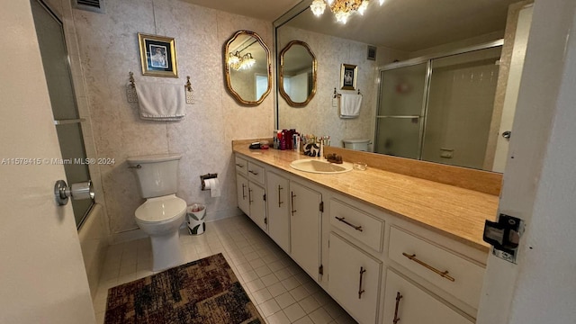 bathroom featuring tile flooring, tile walls, toilet, and vanity