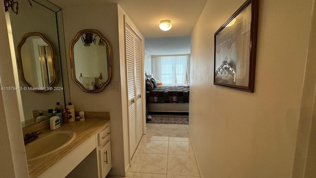 bathroom featuring tile flooring and vanity