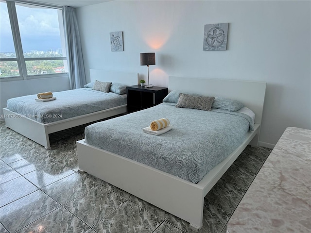 bedroom with tile floors