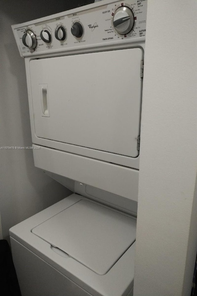 laundry area featuring stacked washing maching and dryer