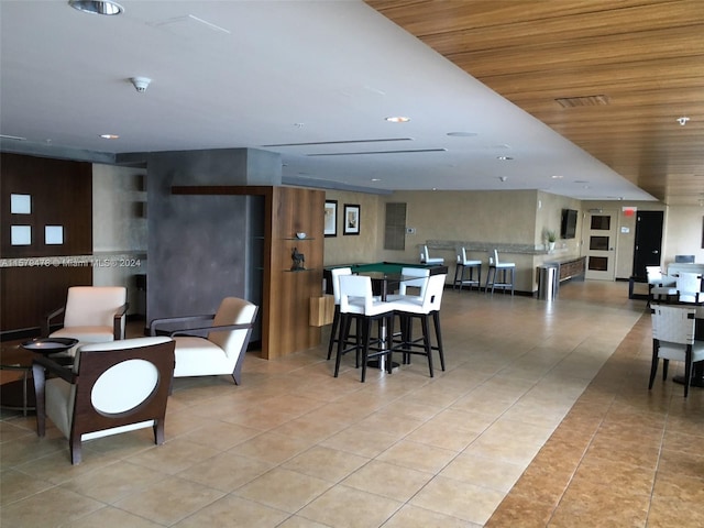 interior space featuring wooden ceiling and light tile floors