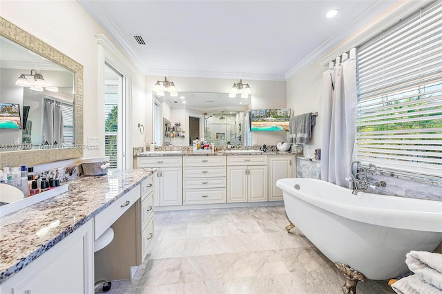 bathroom with ornamental molding, a bathing tub, tile flooring, and vanity