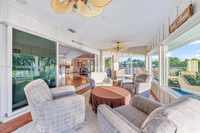 sunroom featuring plenty of natural light and ceiling fan