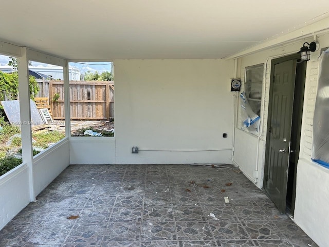 unfurnished sunroom with plenty of natural light