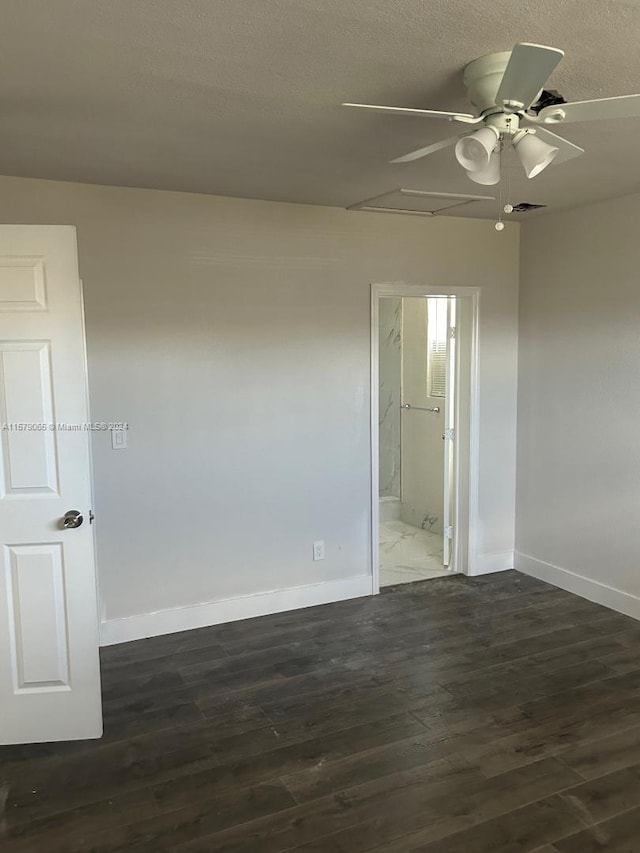 unfurnished room featuring visible vents, baseboards, a ceiling fan, wood finished floors, and a textured ceiling