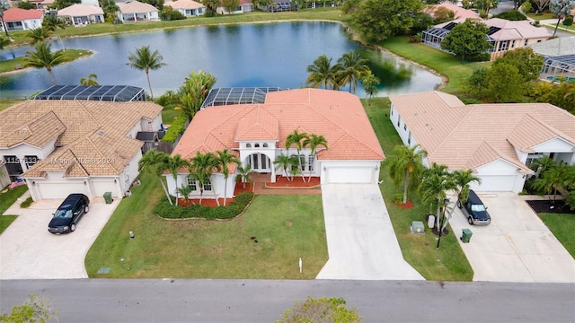 drone / aerial view with a water view and a residential view