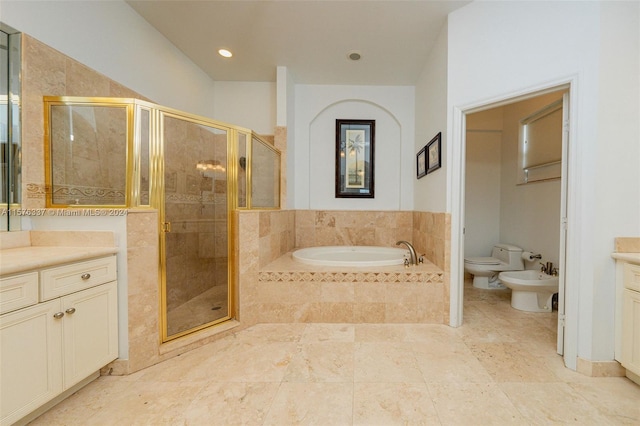 full bathroom featuring toilet, shower with separate bathtub, a bidet, and vanity