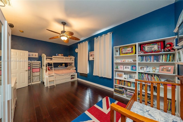 bedroom featuring baseboards and hardwood / wood-style floors