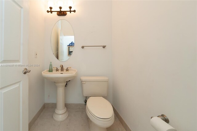 bathroom featuring toilet and tile patterned floors