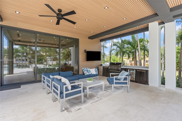 view of patio / terrace with exterior kitchen, a grill, an outdoor living space, and ceiling fan