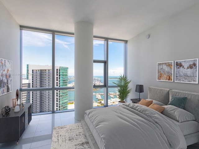 tiled bedroom featuring floor to ceiling windows and a water view